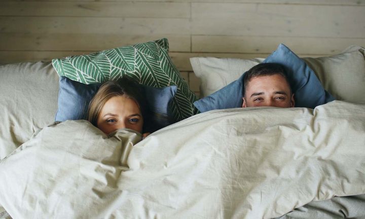 Couple_hiding_under_blanket